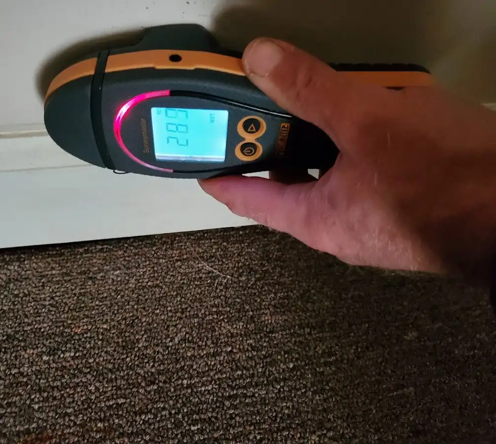 Moisture detection at baseboard during Storm Damage Restoration in Oxnard